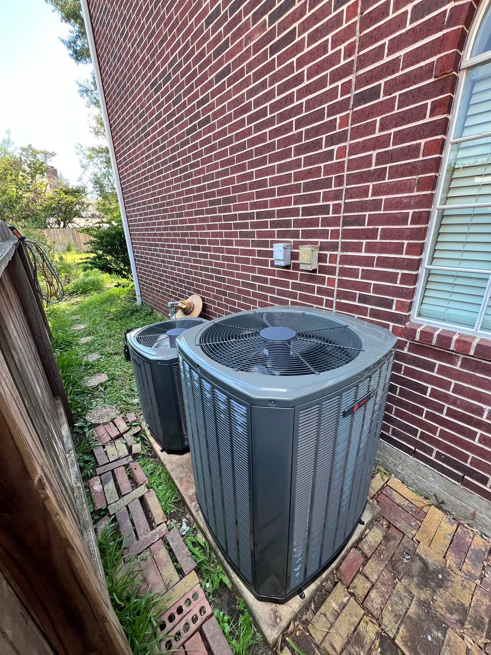 Two Trane condenser units installed at a Houston home by Houston Aircon