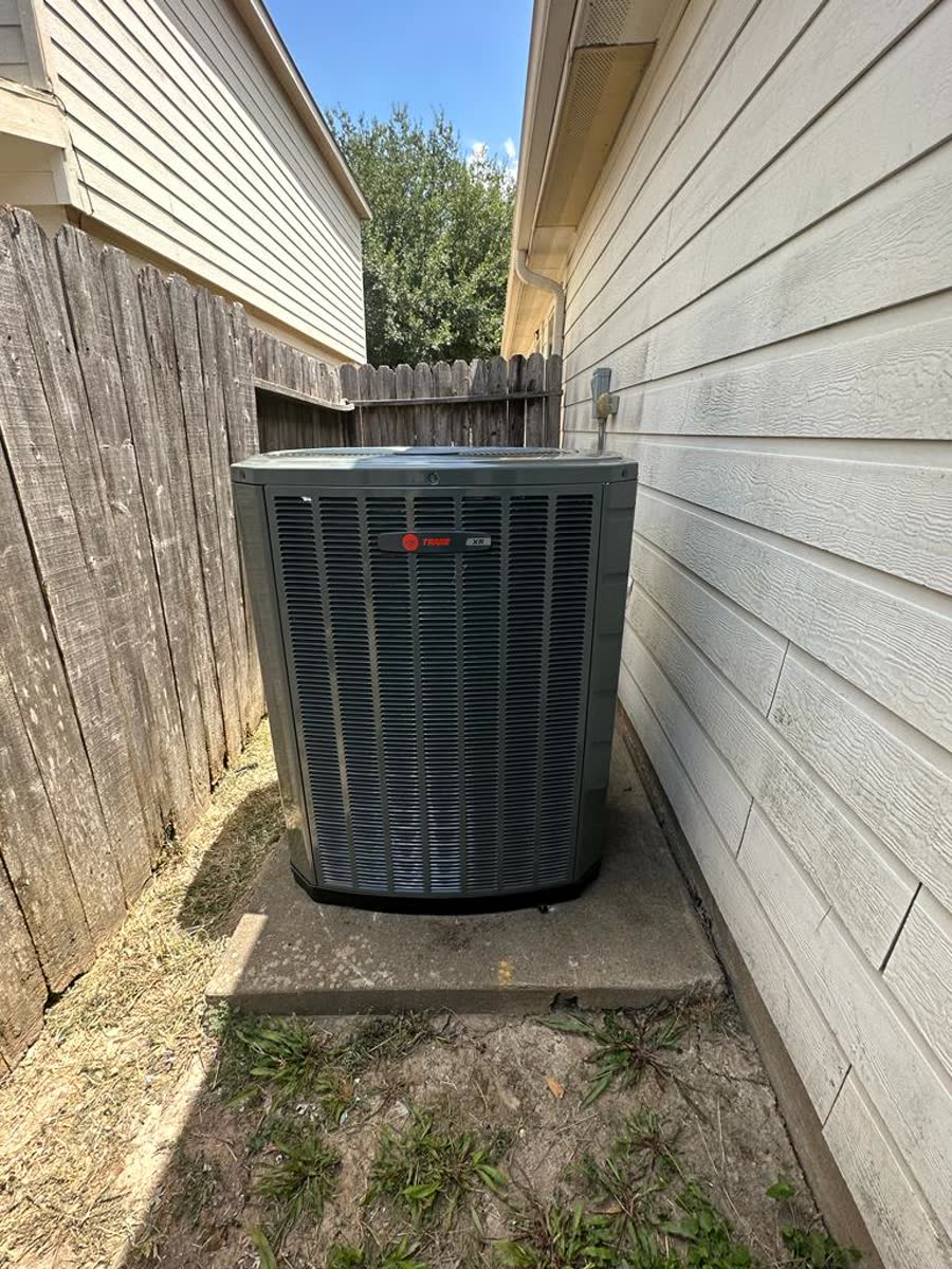 Trane condenser unit installed alongside a Houston home