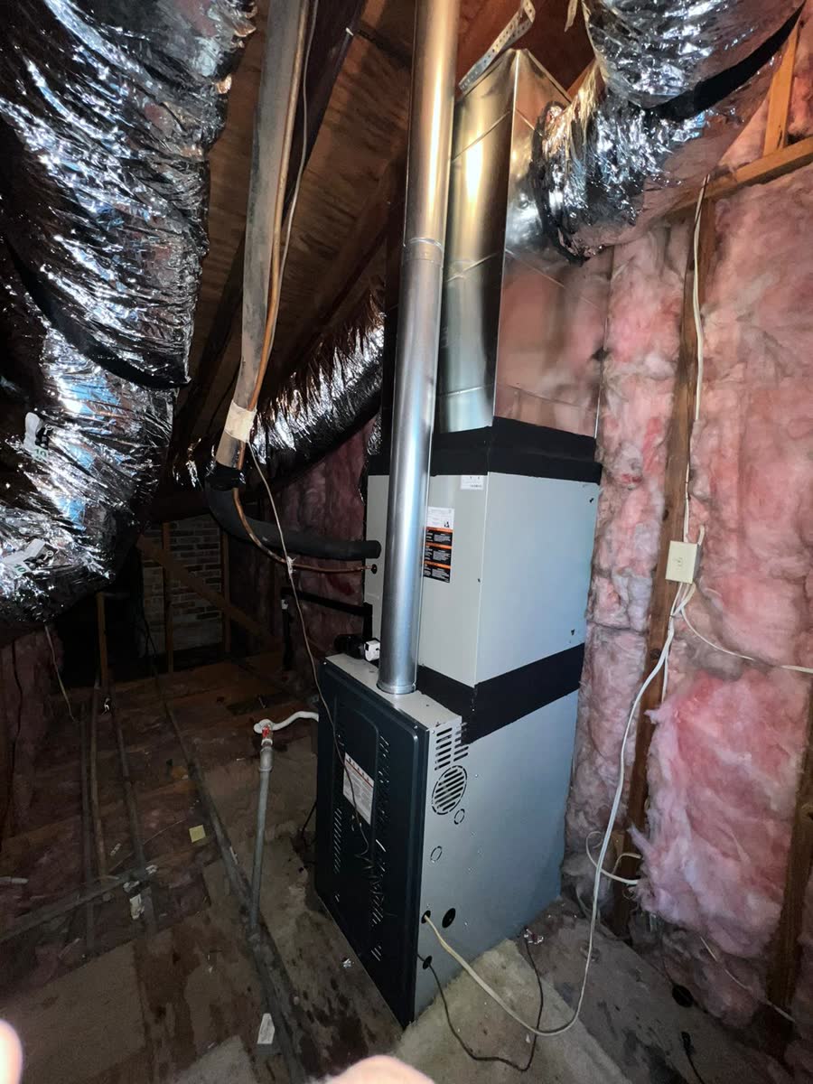 Furnace and air handler unit installed in an attic space