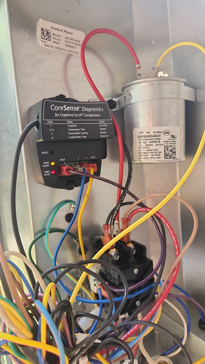 Control panel wiring and compressor diagnostics during an AC repair